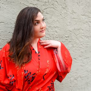 Woman wearing a red kimono on a nice day